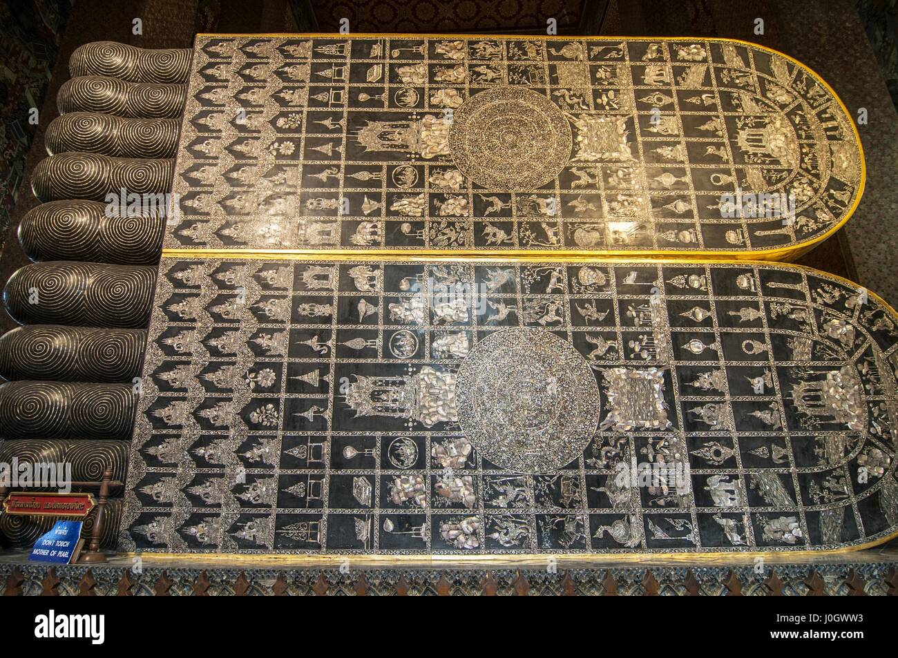Feet of the Golden Reclining Buddha statue at the Wat Pho Temple Bangkok, Thailand Stock Photo