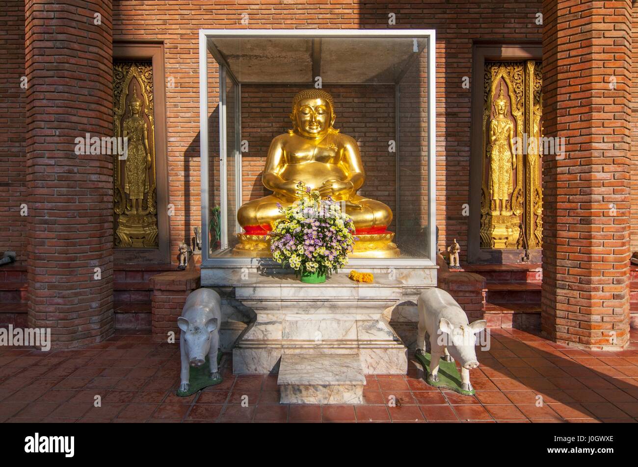 Happy Fat Buddha statue with pigs in Ayutthaya, Thailand Stock Photo