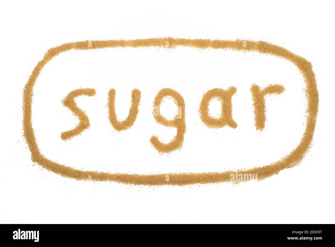 word sugar written with brown granulated sugar isolated Stock Photo