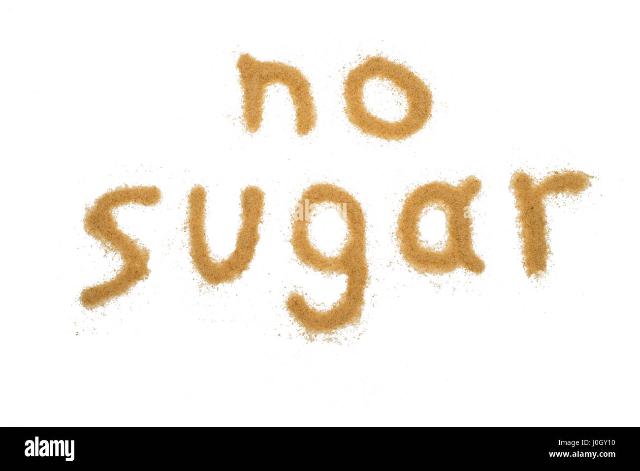 word no sugar written with brown granulated sugar isolated Stock Photo