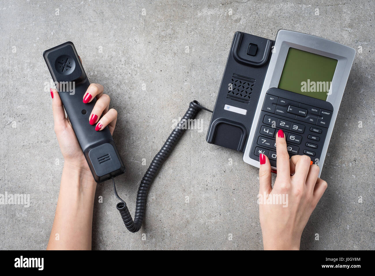 Woman using telephone Stock Photo