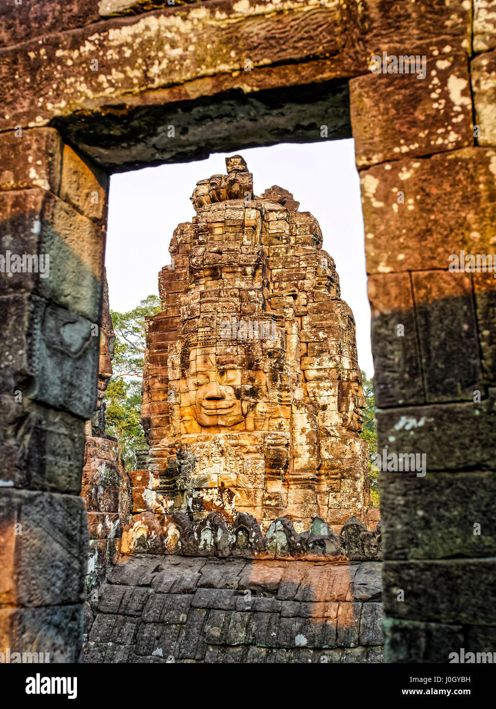 The Bayon is a well-known and richly decorated Khmer temple at Angkor in Cambodia. Built in the late 12th century or early 13th century as the officia Stock Photo