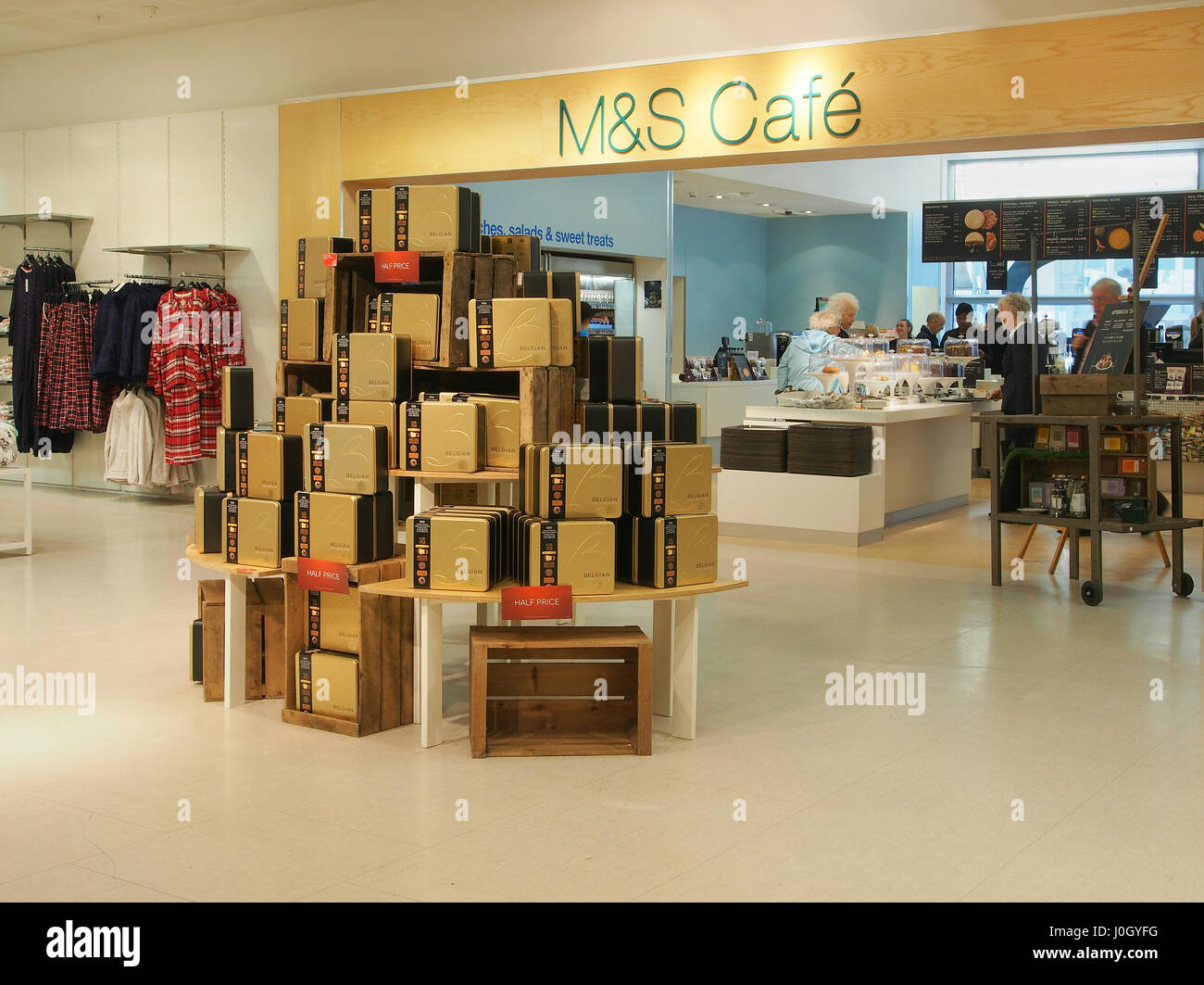 Interior of the Manchester branch of department store Marks & Spencer shop shops in the city centre center showing a chocolate display and the cafe. Stock Photo