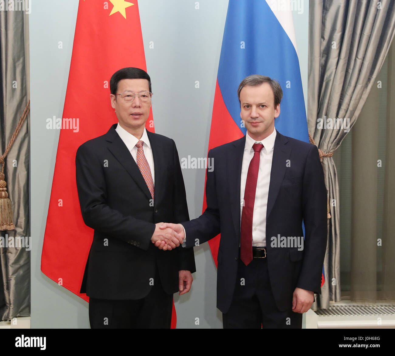 Moscow, Russia. 12th Apr, 2017. Chinese Vice Premier Zhang Gaoli (L) and his Russian counterpart Arkady Dvorkovich shake hands during the meeting of the China-Russia Energy Cooperation Committee in Moscow, Russia, April 12, 2017. Credit: Pang Xinglei/Xinhua/Alamy Live News Stock Photo