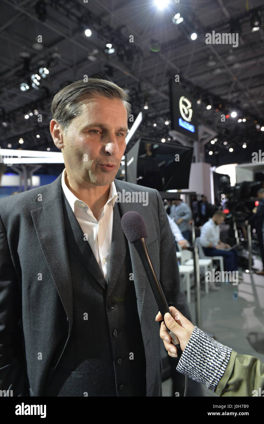 Manhattan, USA. 12th Apr, 2017. KLAUS ZELLMER, President and Chief Executive Officer of Porsche Cars North America, Inc, is interviewed during the Porsche Press Conference at the New York International Auto Show, during the first Press Day at the Javits Center. Two new Porsche cars made their North American Premiere at NYIAS: Panamera Sport Turisomo and 911 GT3. Credit: Ann E Parry/Alamy Live News Stock Photo