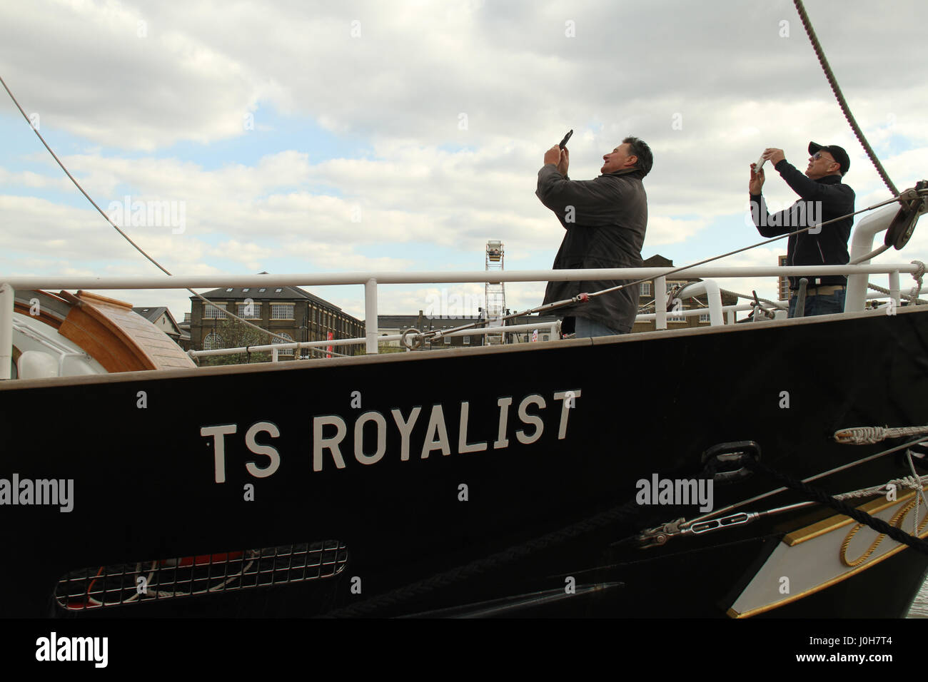 London, UK. 13th Apr, 2017. People seen taking photos on board the TS Royalist, docked at Woolwich Pier. Around 40 Tall Ships are scheduled to sail the river Thames to Greenwich, marking the 150th anniversary of the Canadian Confederation. Over the Easter weekend, on 13 to 16 April 2017, the ships will be anchored at the Maritime Greenwich UNESCO World Heritage Site in Greenwich town centre, and at the Royal Arsenal Riverside in Woolwich before they sail to Quebec, Canada, via Portugal, Bermuda and Boston. Credit: David Mbiyu/Alamy Live News Stock Photo
