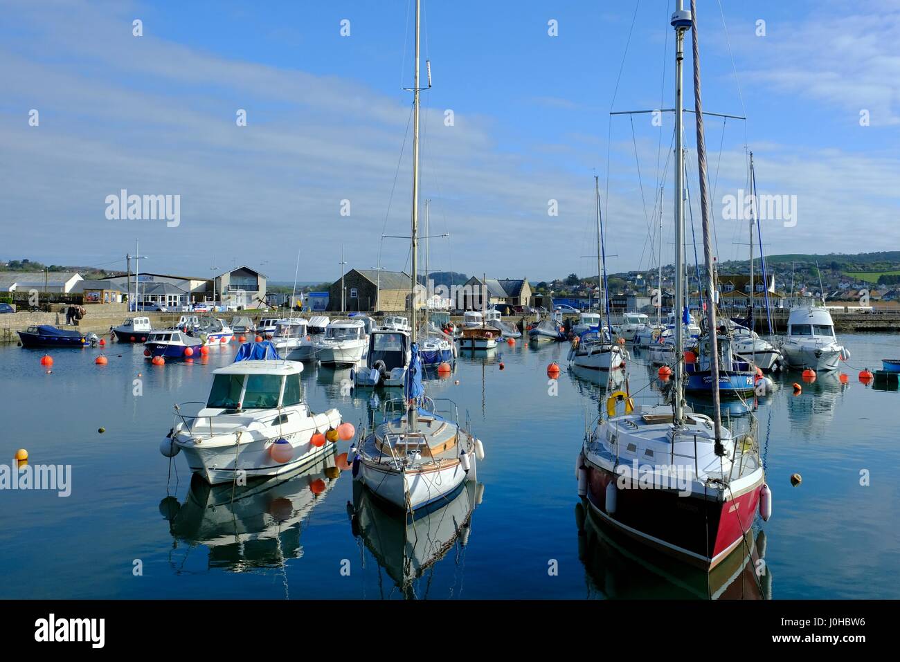 West Bay, Dorset, UK. 14th Apr, 2017. A glorious start to bank holliday friday ot West Bay harbour made famius by the TV series Broadchurch. Credit: Tom Corban/Alamy Live News Stock Photo