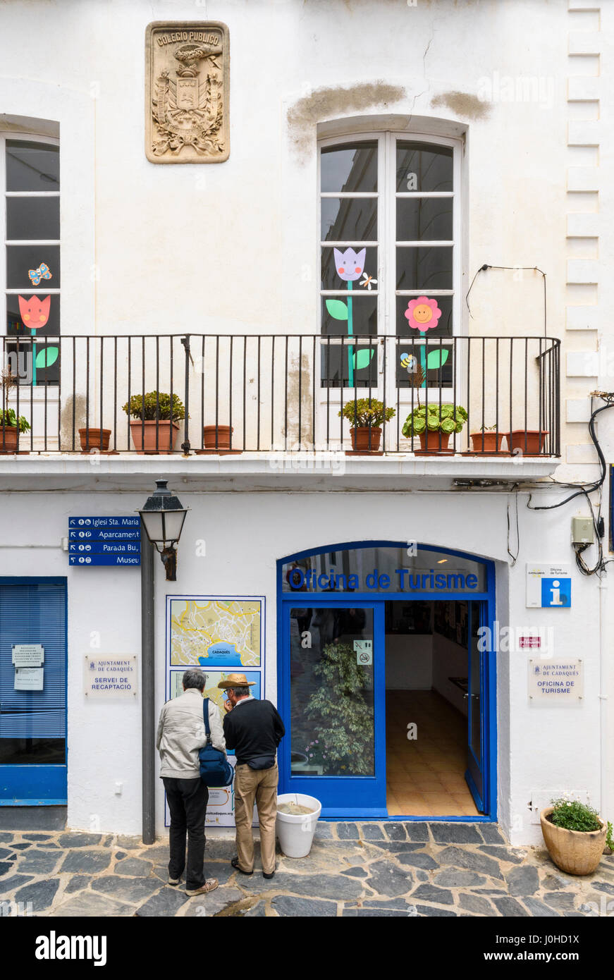 Tourists outside the Tourist Office, Cadaques, Catalonia, Spain Stock Photo