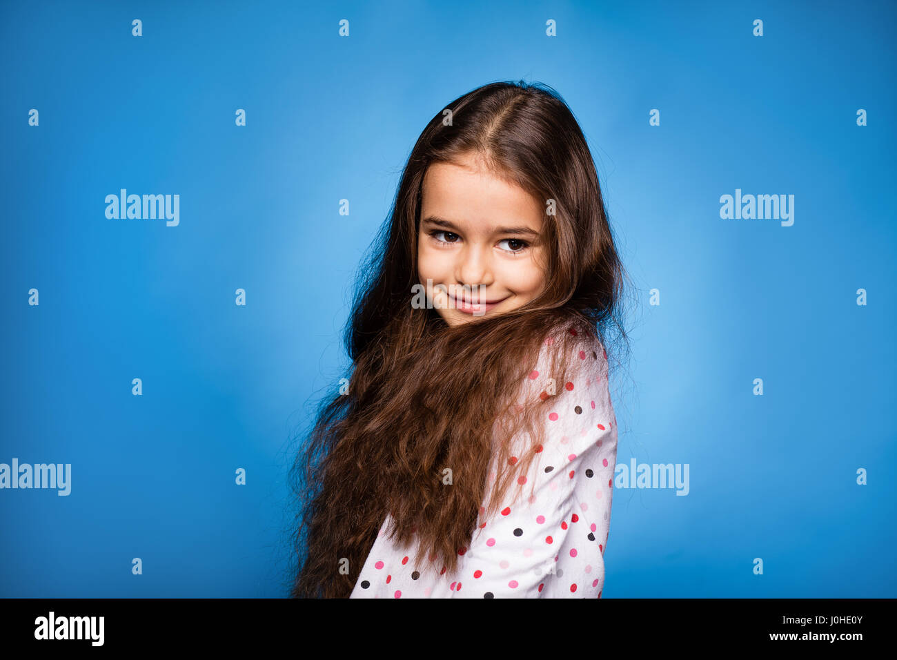 beautiful little girl with curls, smiling Stock Photo