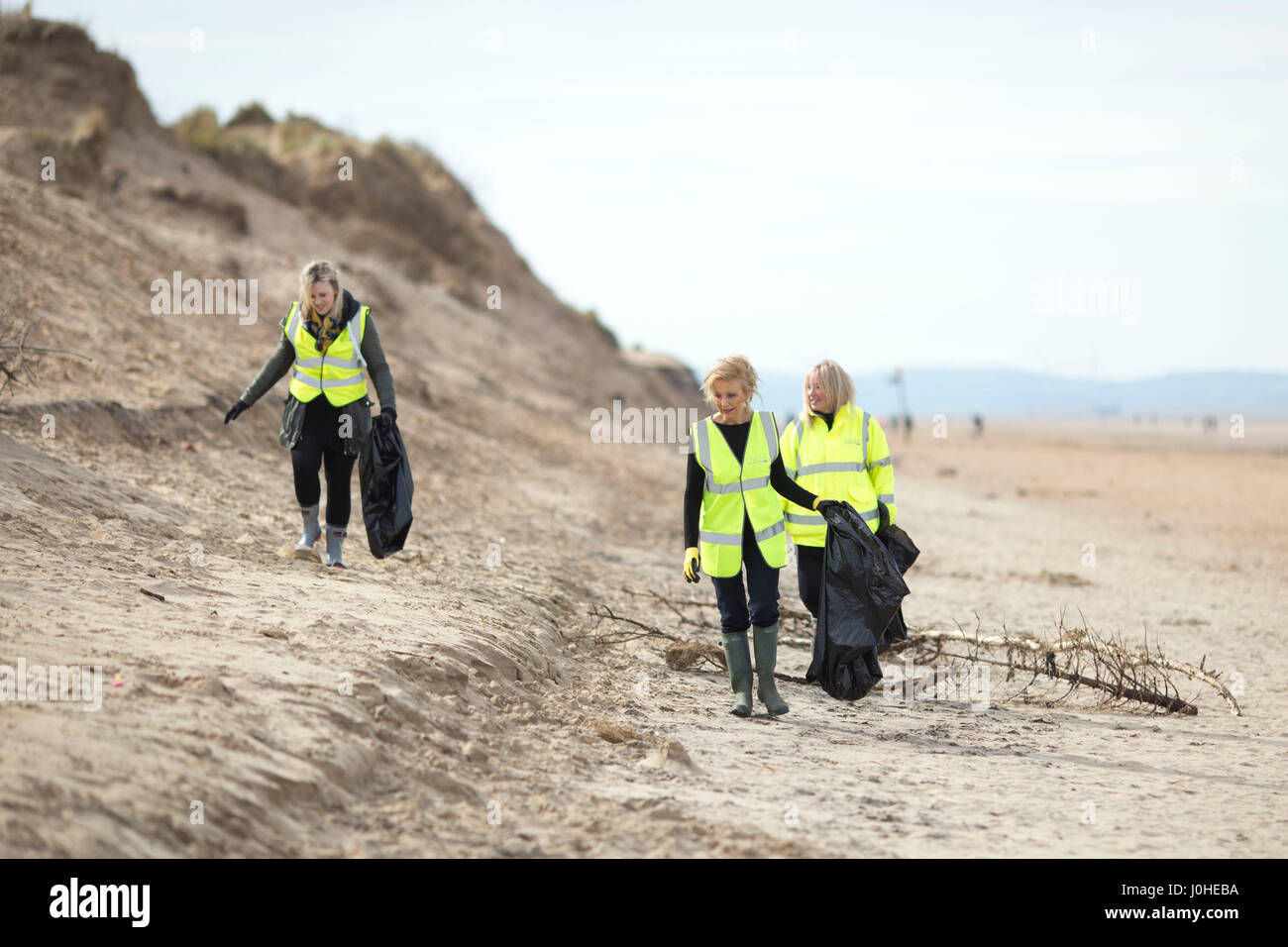 Litter pick on Formby beach UK Stock Photo