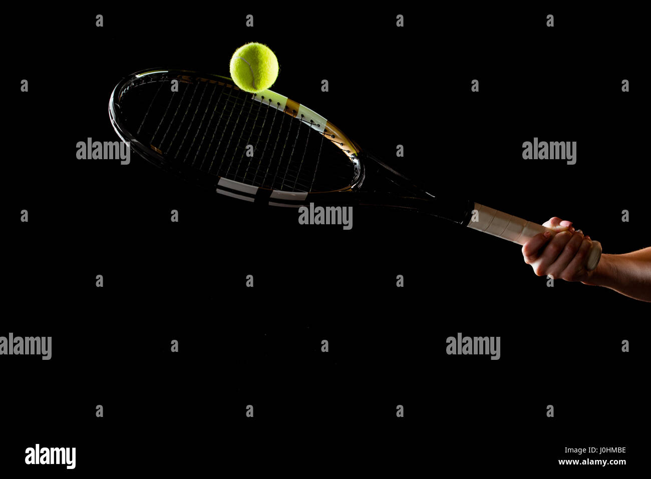 Tennis ball hitting racket close up hires stock photography and images