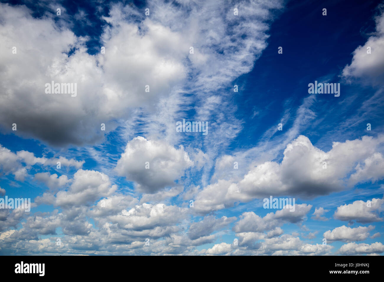Cloudy blue sky background Stock Photo - Alamy
