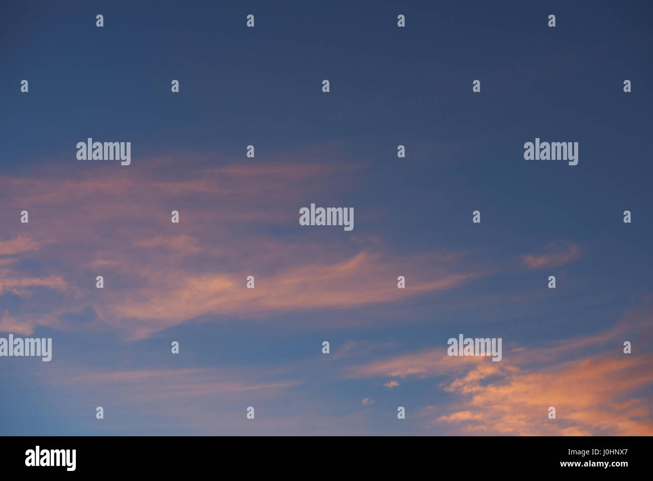 Pink clouds on dusk blue sky background. Beautiful natural sunset sky ...