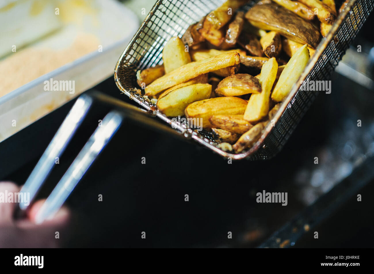 Portion of Hand Cut Potato Chips in a Frying Pan Stock Photo