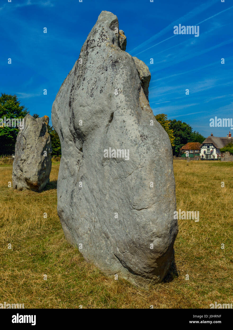 A portrait view of a neolithic standing stone at the stone circle of Avebury, in Wiltshire, UK. Stock Photo