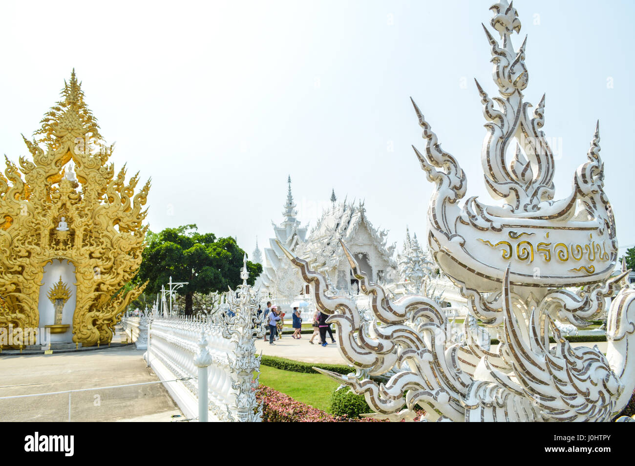 Chiang Rai, Thailand - April 4, 2017 : Wat Rong Khun or White Temple, designed and constructed by Chalermchai Kositpipat. Stock Photo
