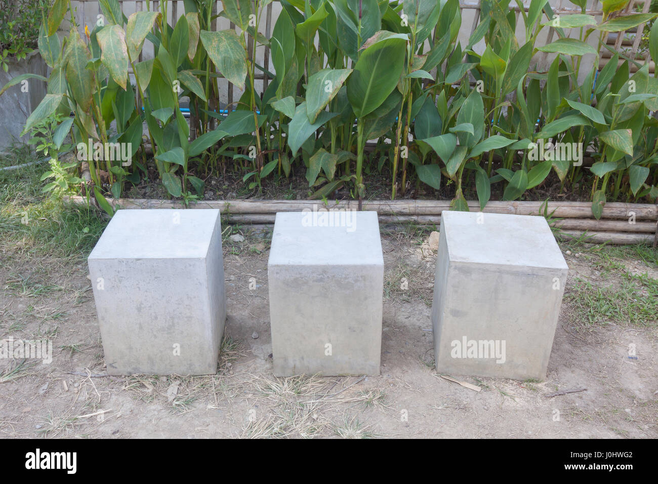 Concrete chairs in the garden Stock Photo