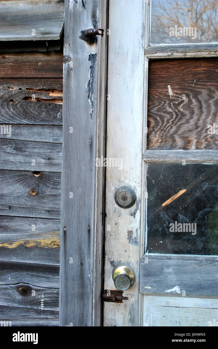 Old Door With Wood Replacing Window Pane Stock Photo