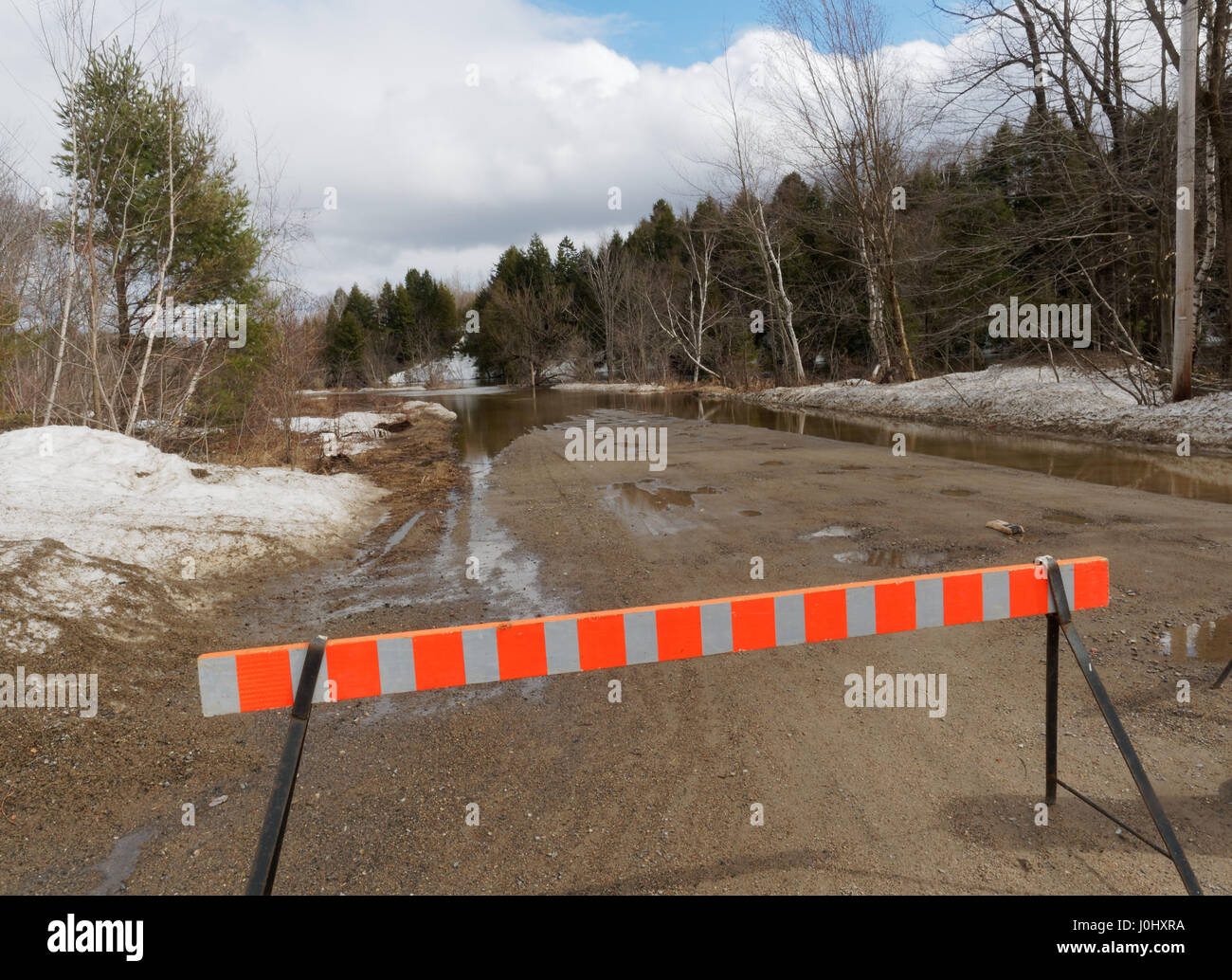 Road closed due to spring flooding Stock Photo