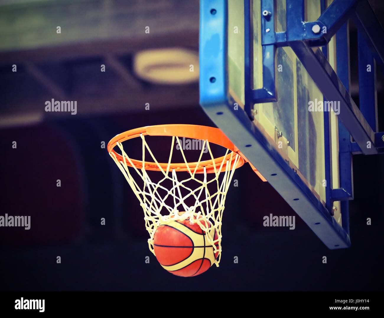 basketball going into the basket after a fantastic shot Stock Photo - Alamy