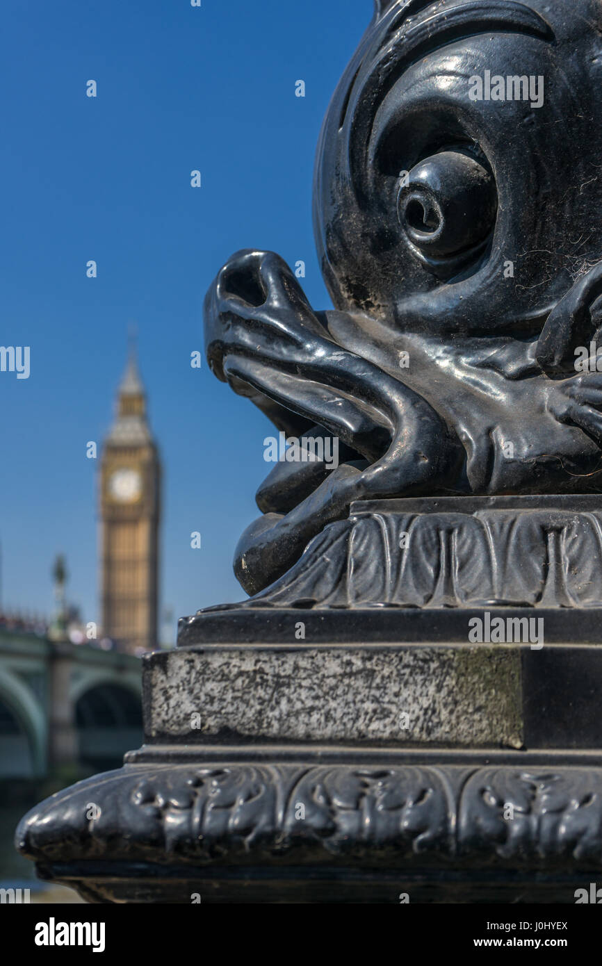 One of the ornate Dolphin lamp standards that provide electric light along much of the Thames Embankment in London, England. Stock Photo