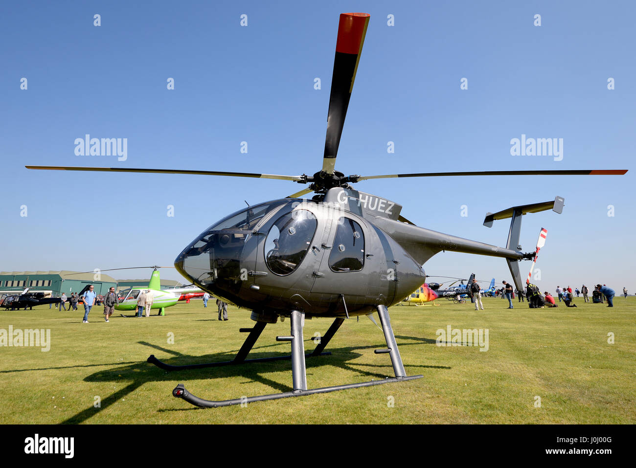 MD Hughes 500 helicopter G-HUEZ owned by Falcon Helicopters Ltd, on the ground during a helicopter fly-in Stock Photo