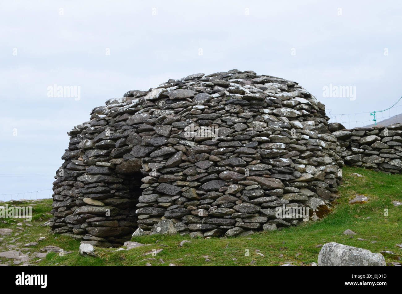 Dry stone beehive hut on the Dingle Penninsula in Ireland. Stock Photo