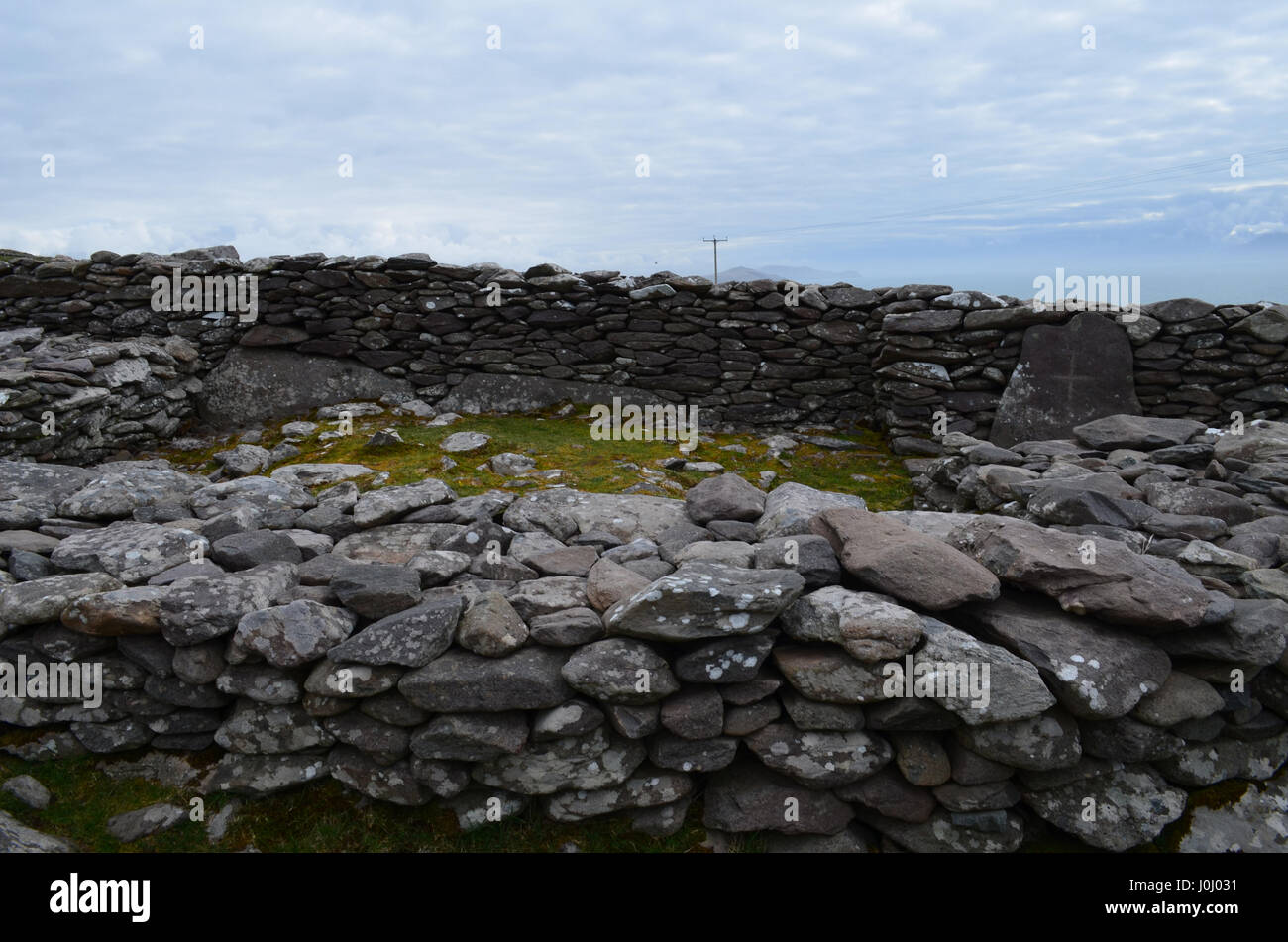 Stone ruins of a beehive hut village on Slea Head Penninsula Stock ...