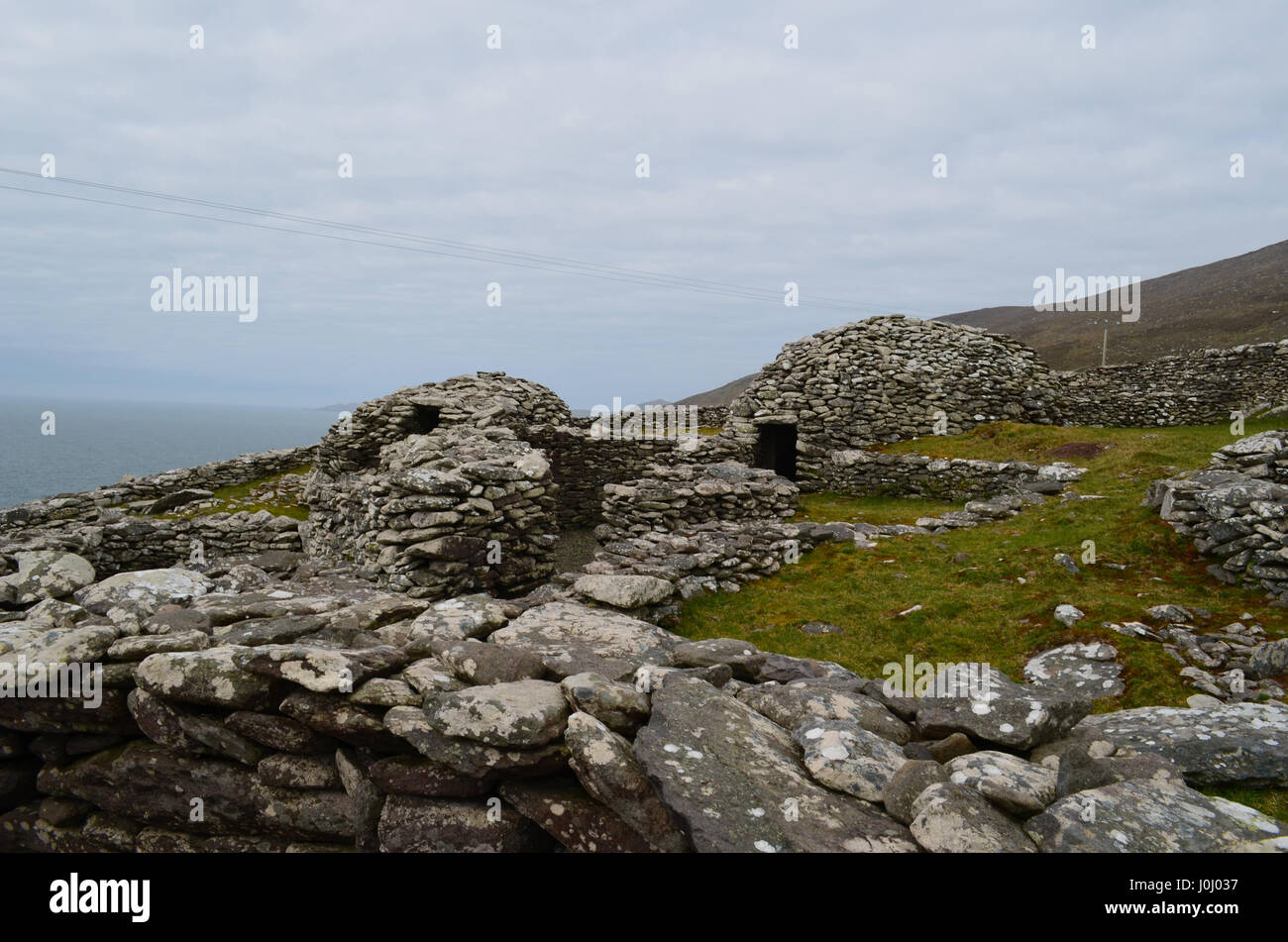 Clochan beehive hut village on the Slea Head Penninsula in Ireland ...