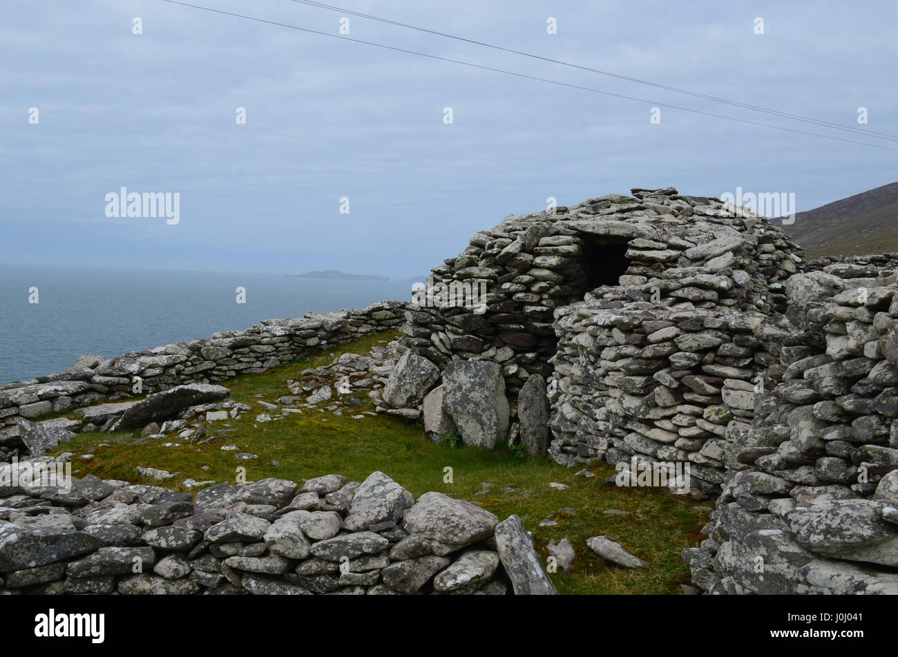 Large stone beehive huts still standing on the Slea Head Penninsula ...