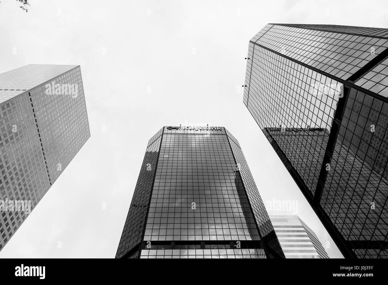 Denver, USA - May 25, 2016: Looking up skyscrapers of the World Trade Center Denver, one of them with a Keybank sign. The picture is in monochrome. Stock Photo