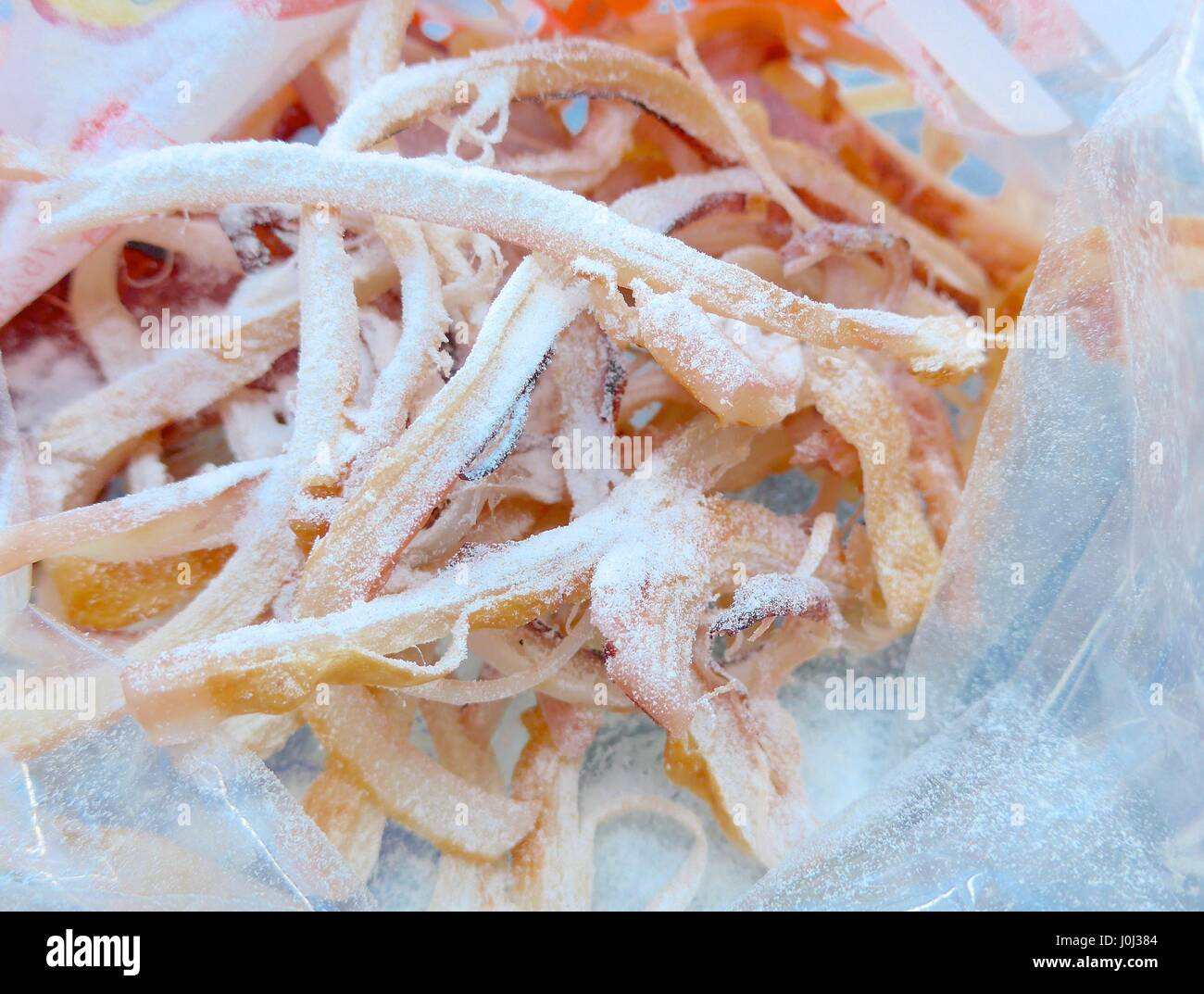 Dried shredded squid closeup Stock Photo - Alamy