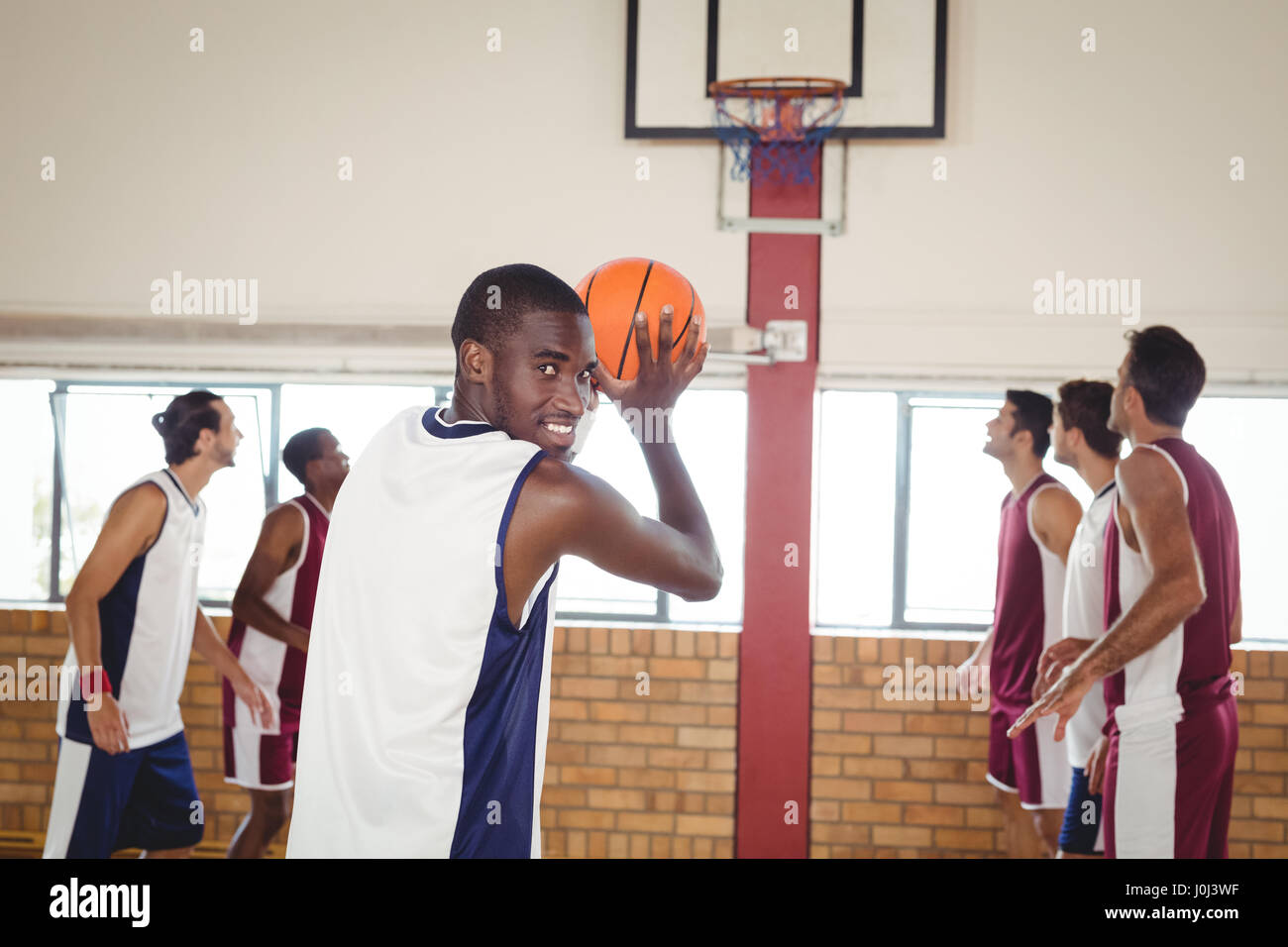 Portrait of basketball player taking a penalty shot Stock Photo - Alamy