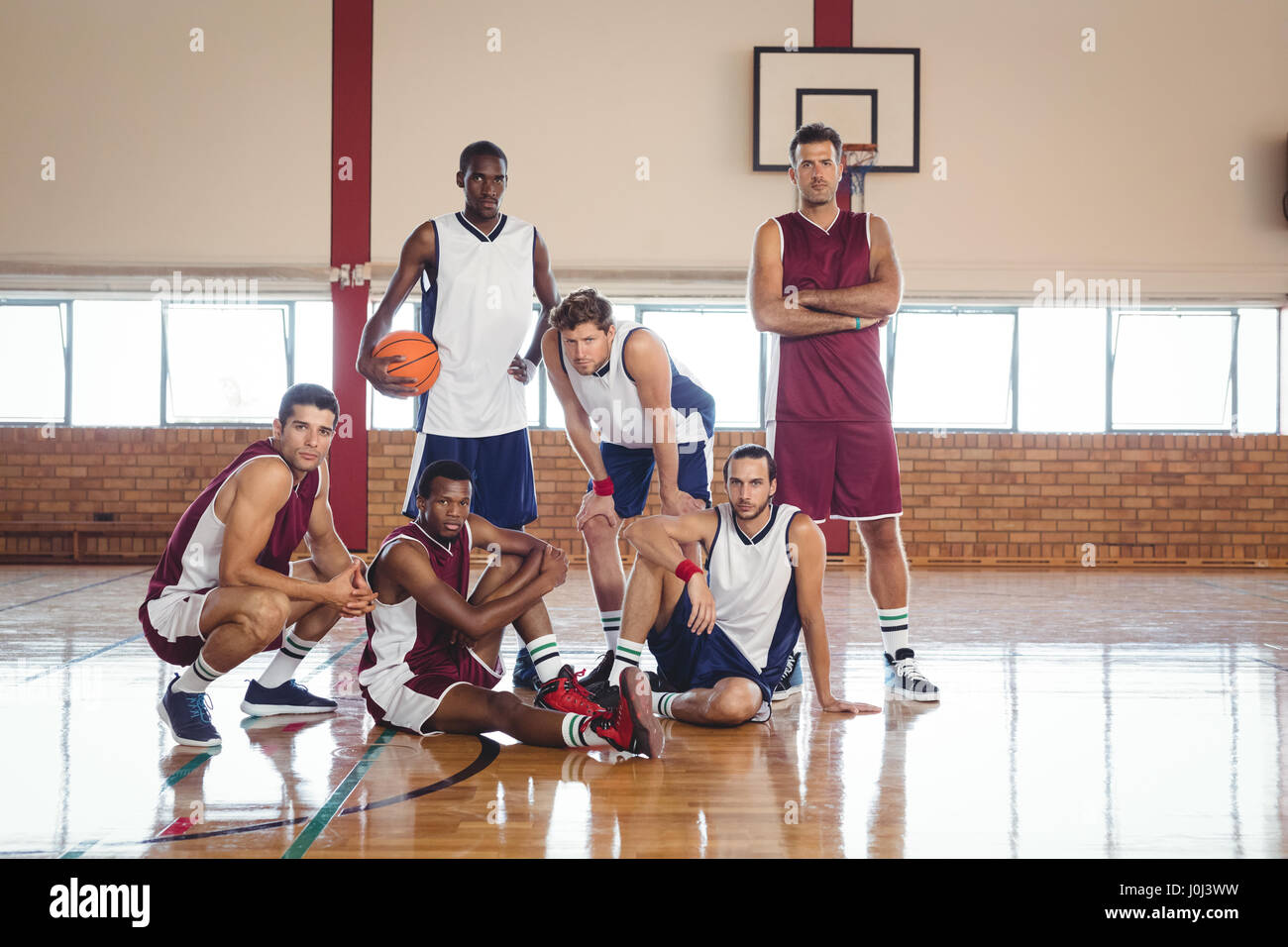 Portrait of confident basketball players in the court Stock Photo Alamy