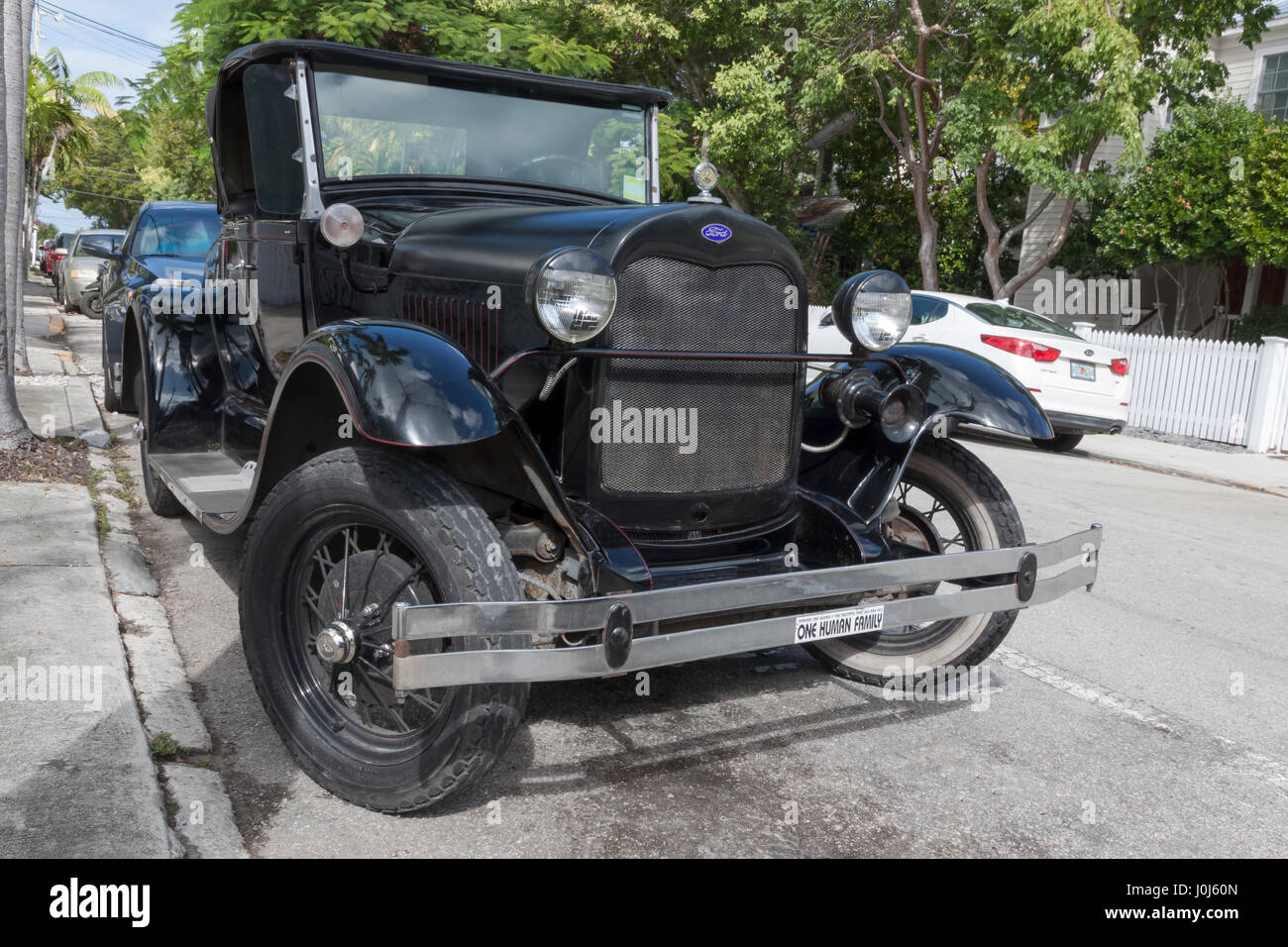 Shay Model A Roadster, a fiberglass reproduction of a Ford Model A placed on a modern chassis, parked on the street. Stock Photo