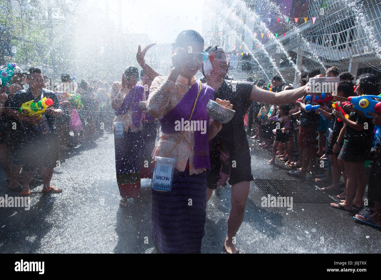 Bangkok, Thailand. 13th Apr, 2017. 13 April, 2017. Traditional Thai dancers reacts during a water fight at Songkran Festival celebrations in Bangkok, Thailand. Credit: Anusak Laowilas/Pacific Press/Alamy Live News Stock Photo