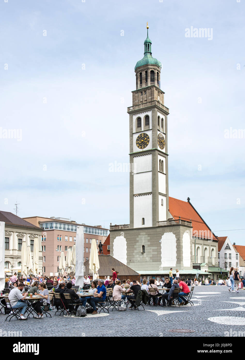 AUGSBURG, GERMANY - APRIL 1: Tourits at a street cafe  in Augsburg, Germany on April 1, 2017. Augsburg is one of the oldest cities of Germany. Foto ta Stock Photo
