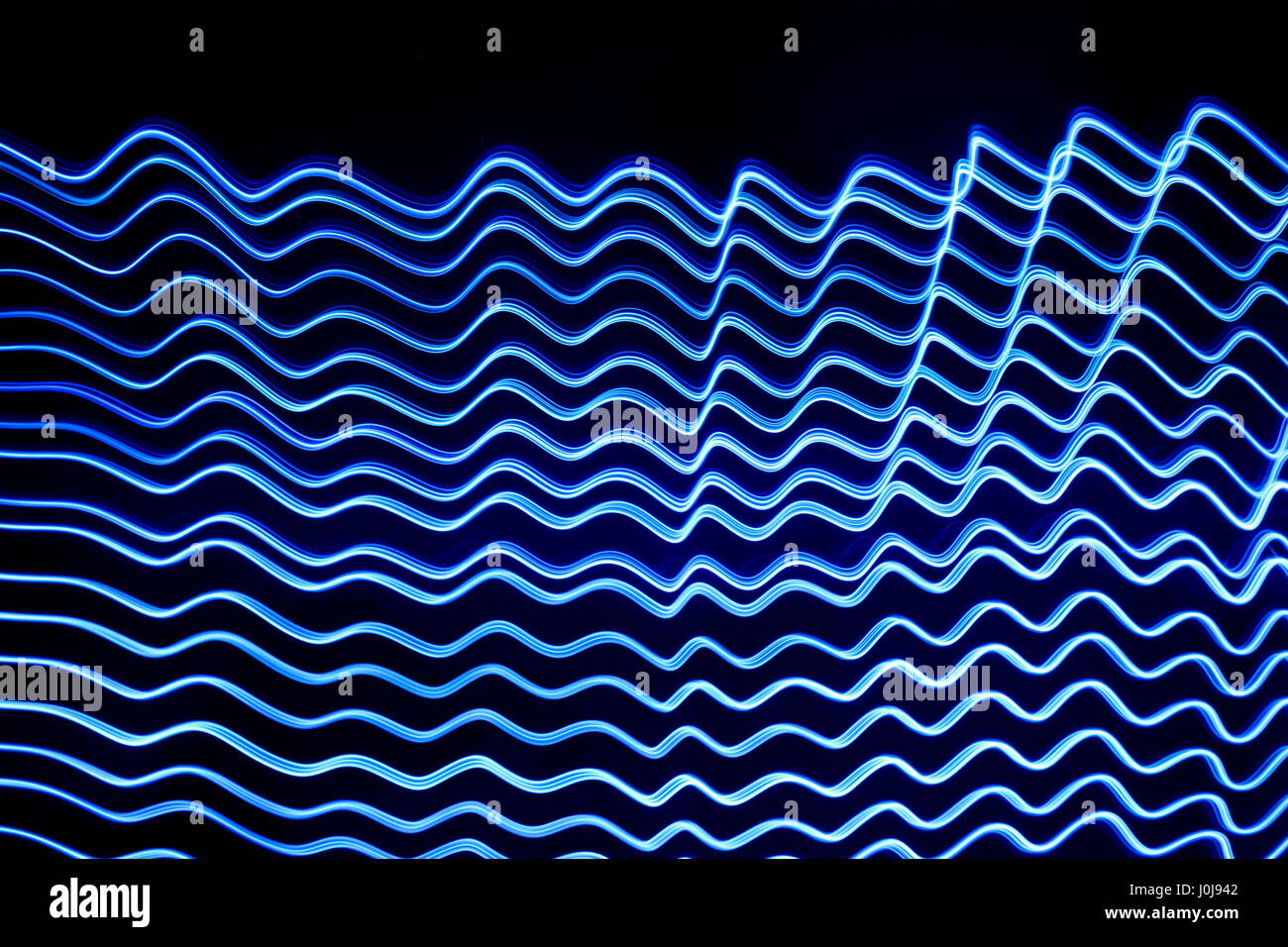 Blue light painting photography rippled effect parallel lines on a
