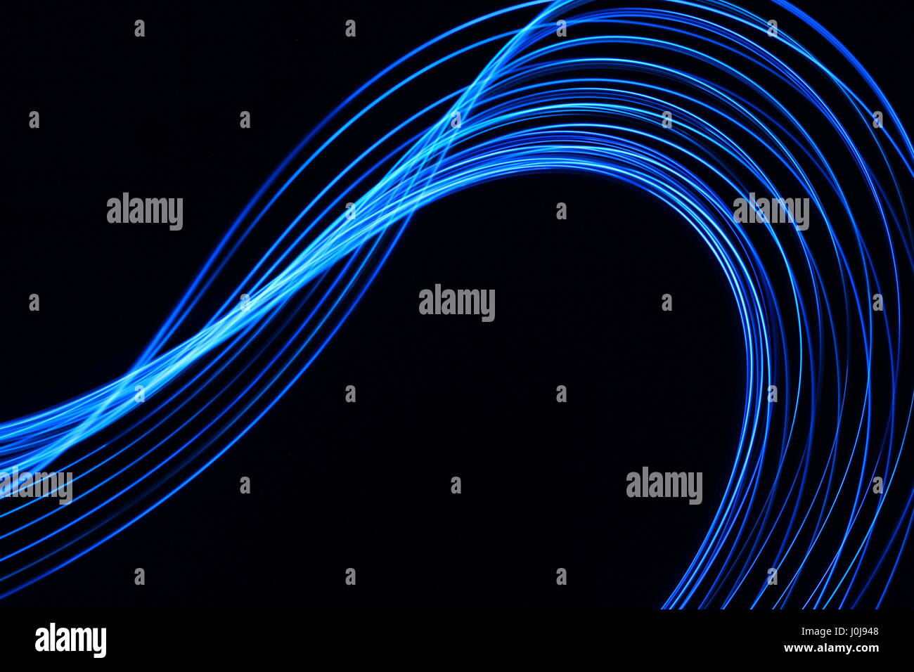 Blue light painting photography - swirls and waves on a black ...