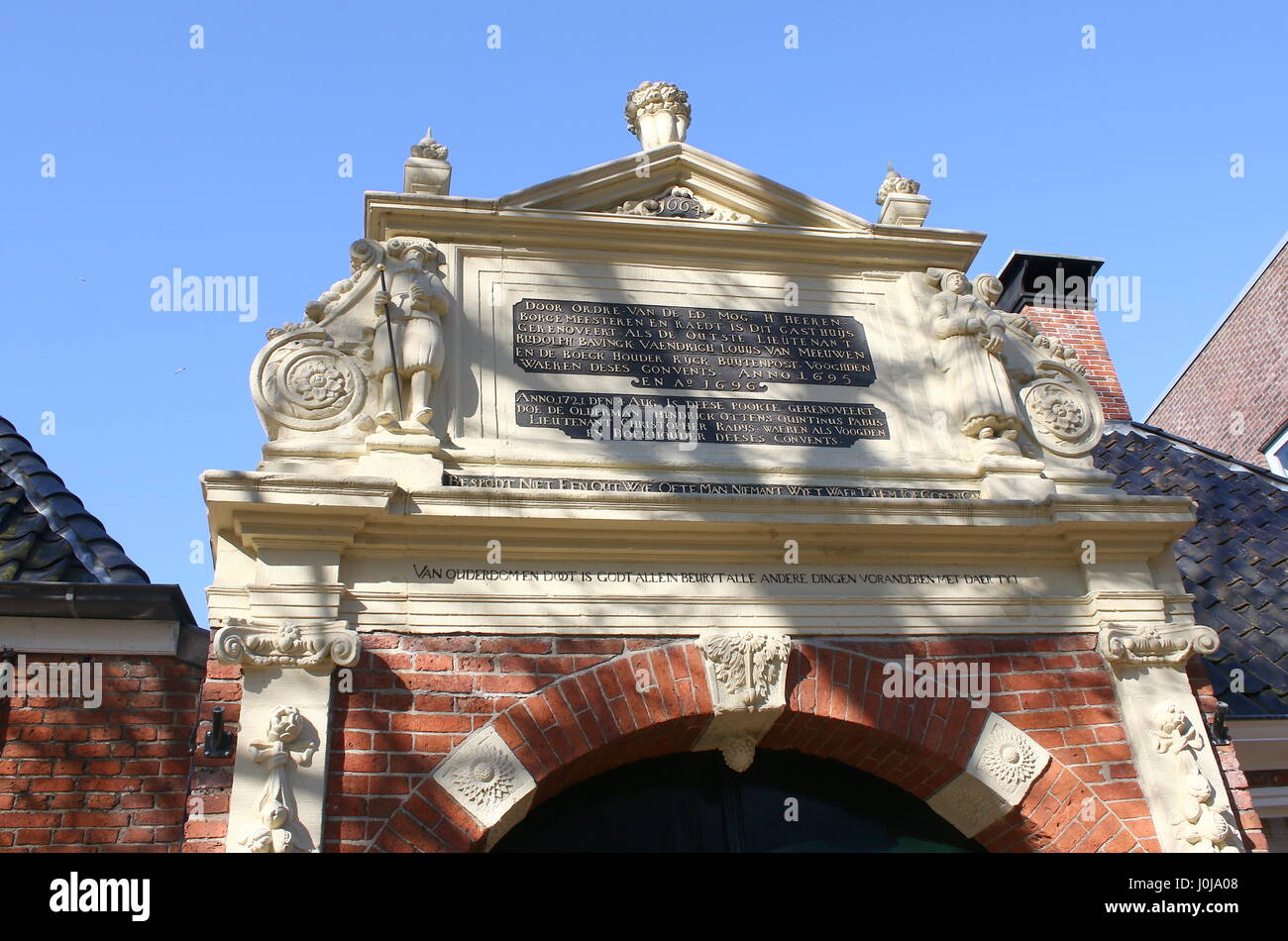 Gable stone, entrance Sint Anthonygasthuis (Saint Antony's Hofje = courtyard with Almshouses), inner city of Groningen, Netherlands. Founded in 1517. Stock Photo