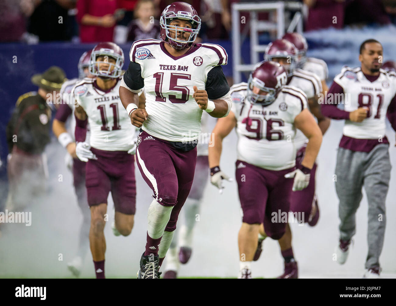 Texas A&M Aggies defensive lineman Myles Garrett (15) enters the field prior to the Texas Bowl NCAA football game between the Texas A&M Aggies and the Kansas State Wildcats at NRG Stadium in Houston. Stock Photo