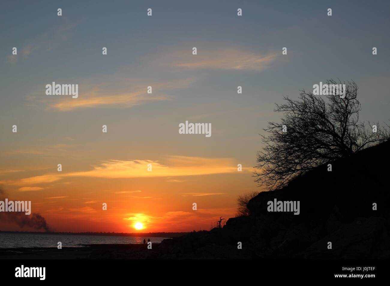 Sunset over boat on sea hi-res stock photography and images - Alamy