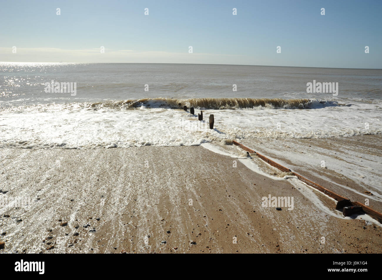 tide Rolling away Stock Photo - Alamy