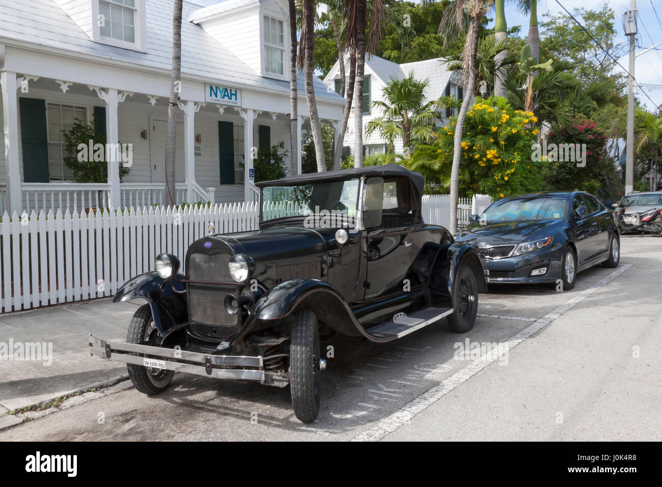 Shay Model A Roadster, a fiberglass reproduction of a Ford Model A placed on a modern chassis, parked on the street. Stock Photo