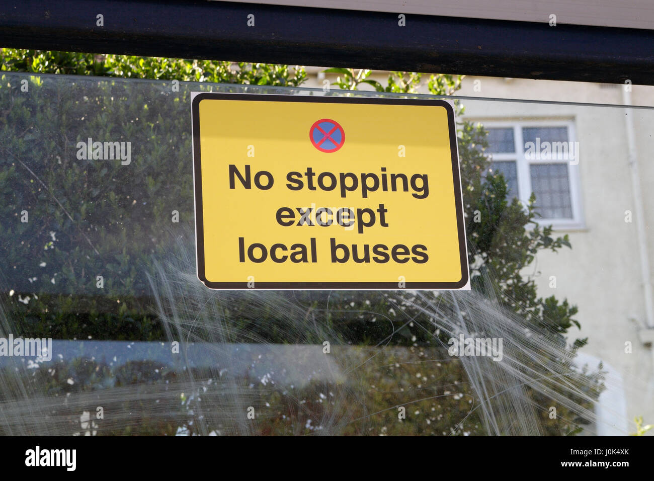 No stopping except local buses sigh on Bus Shelter Stock Photo