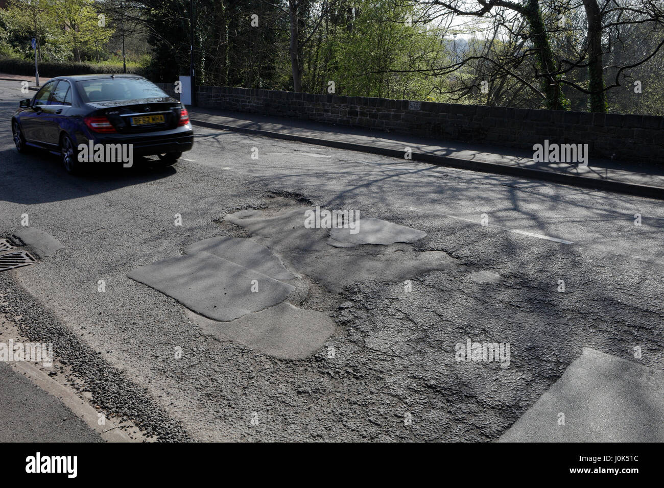 Poor quality road surface, Archer Rd Sheffield UK Stock Photo