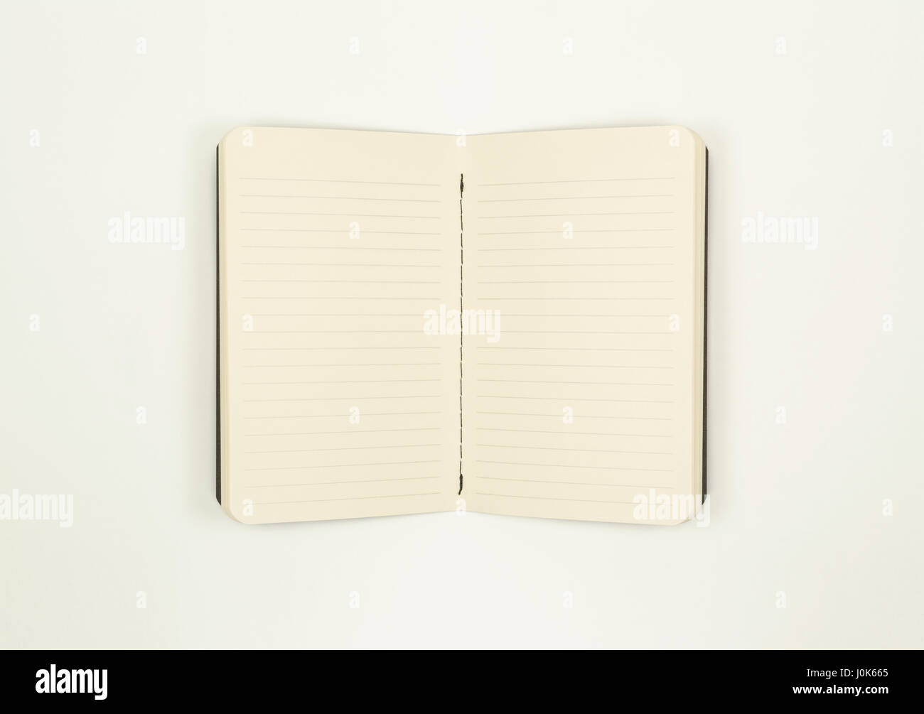 Open notebook with lined paper with clipping path stock photo alamy