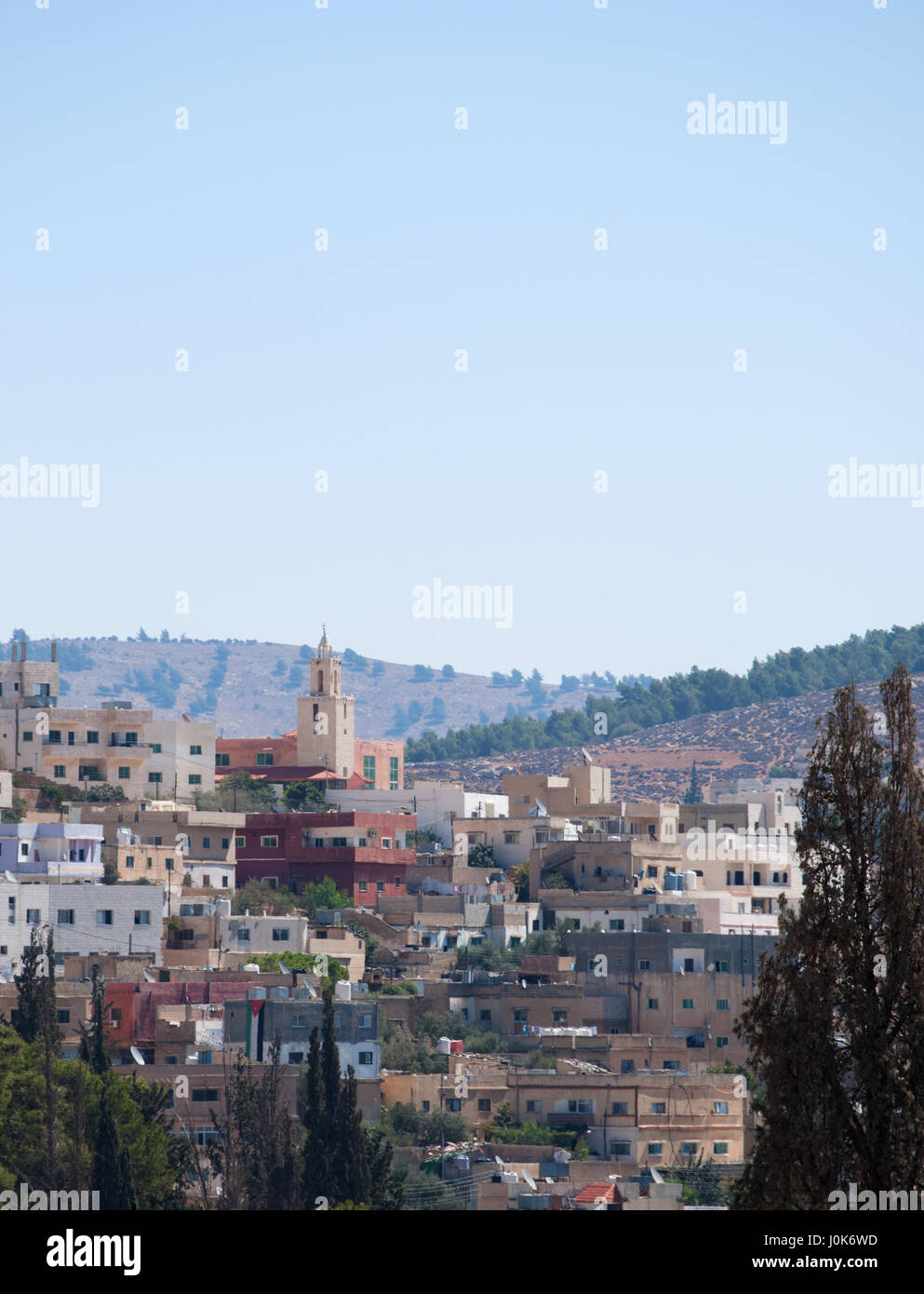 The skyline of modern Jerash, the Gerasa of Antiquity, one of the largest and most well preserved sites of Roman architecture in the world Stock Photo