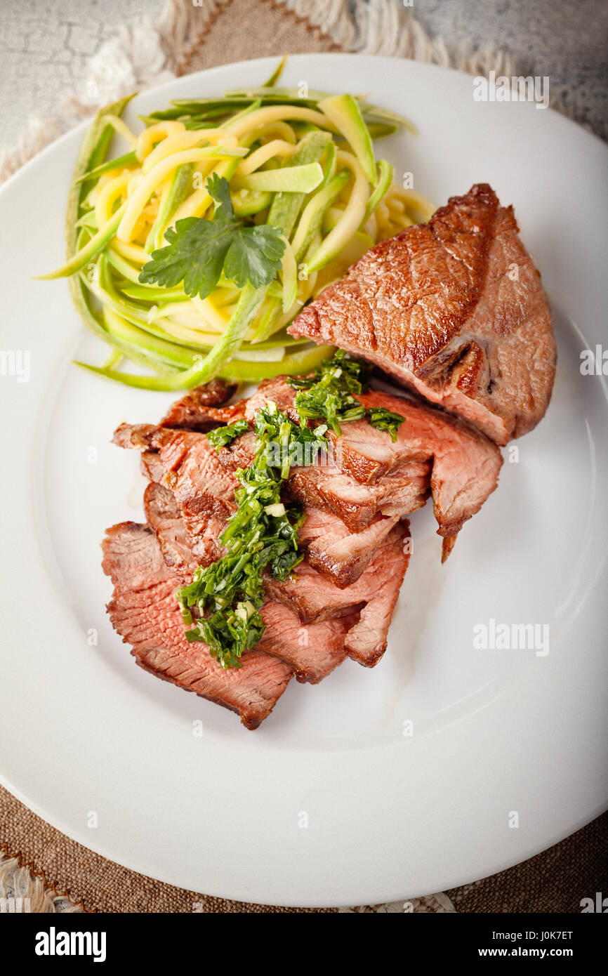 Zucchini pasta and meat Stock Photo