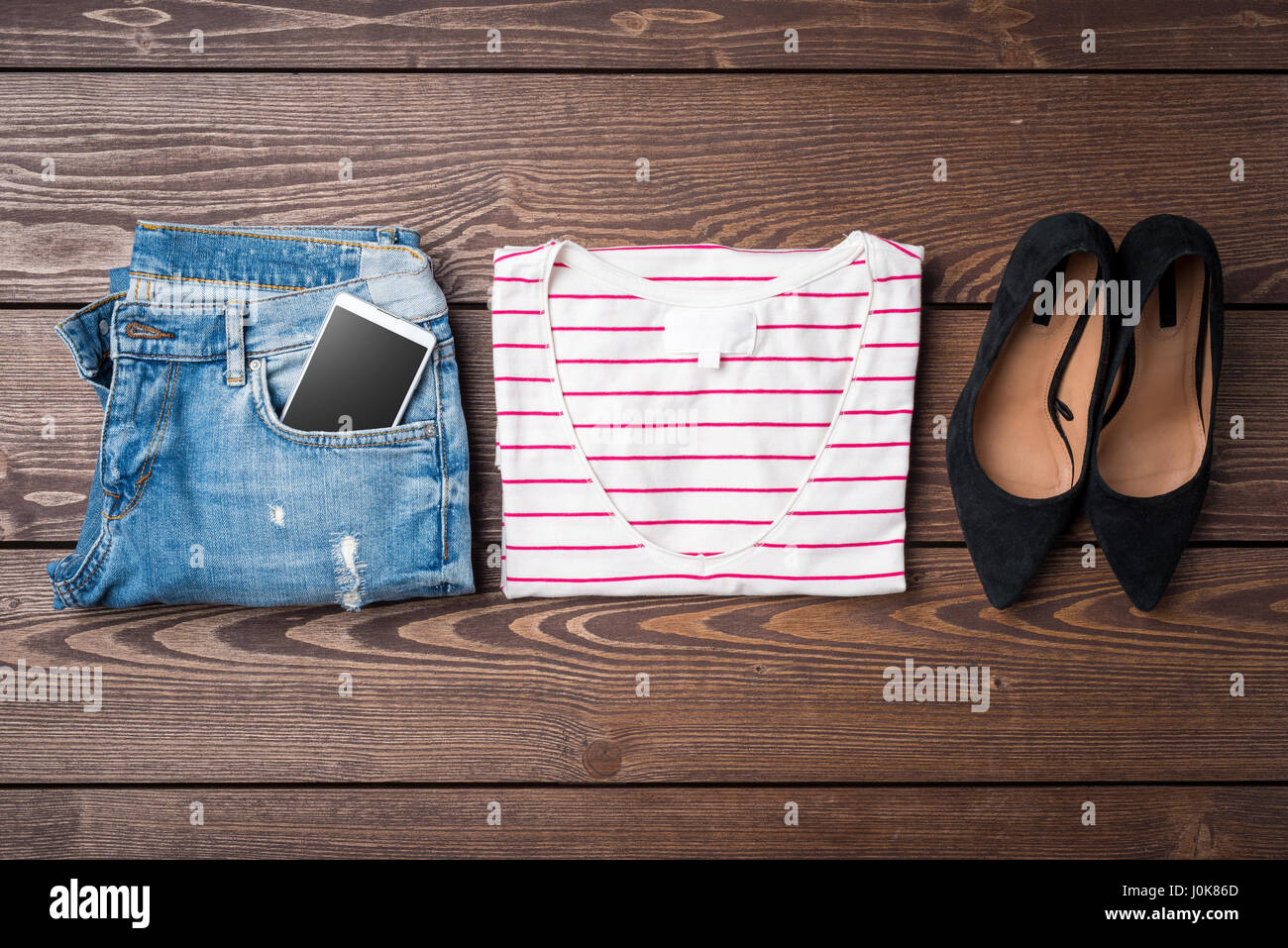 Female clothes on wooden table Stock Photo - Alamy